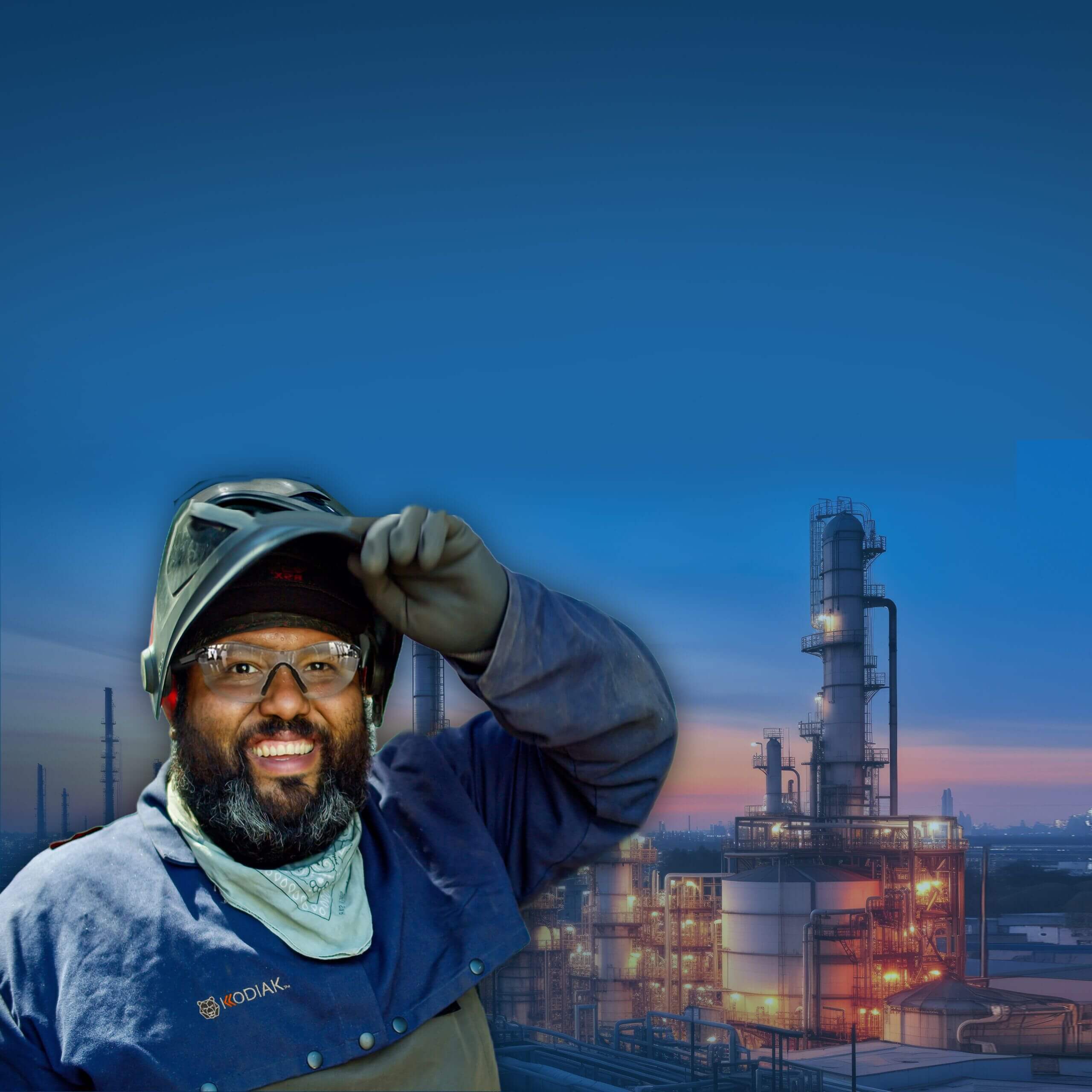 Industrial worker at refinery facility during dusk