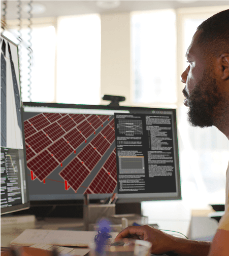 Professional reviewing solar panel design on monitor
